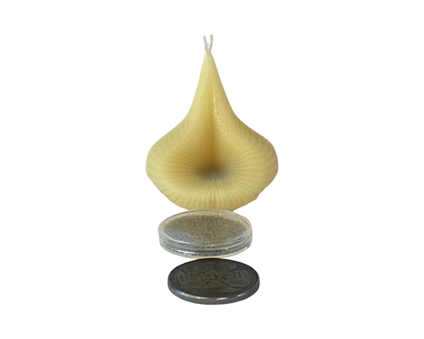 The Natural Golden Beeswax Destiny Decision Candle has a coin sized container of silver Destiny Sparkles with the yes/no answer coin. 